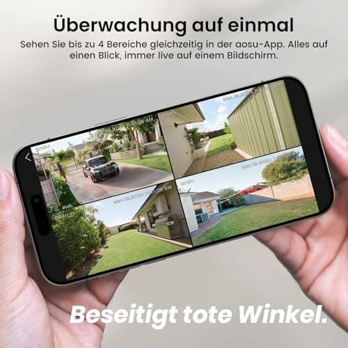 Hand hält Smartphone mit Überwachungsbildern.